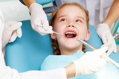Pediatric Dentist in Belagavi: When Should You Take Your Child to the Dentist?